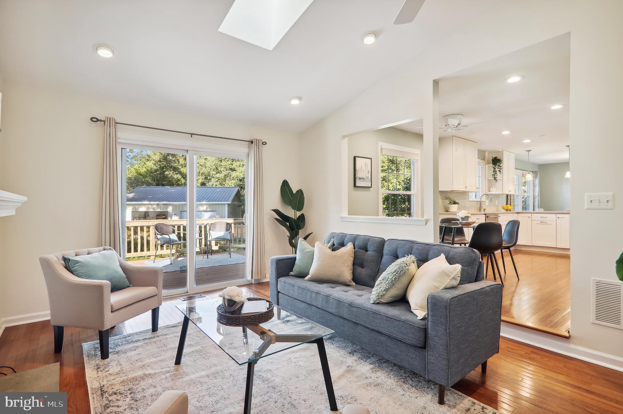 10902 Breewood Road Silver Spring, MD 20901 - Photo 17 of 41 Family room with vaulted ceiling with skylights