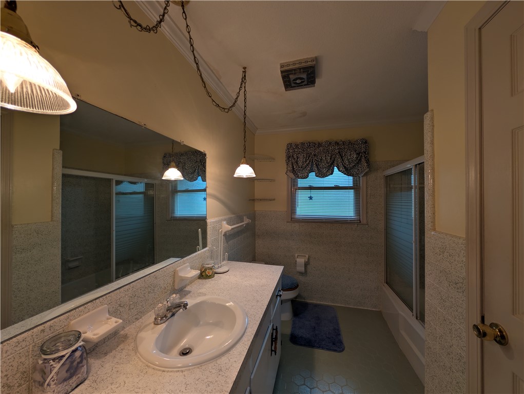1000 Hickory Lane Anderson, SC 29624 - Photo 8 of 37 This bathroom features a functional vanity and a shower-tub combination, designed for comfort.