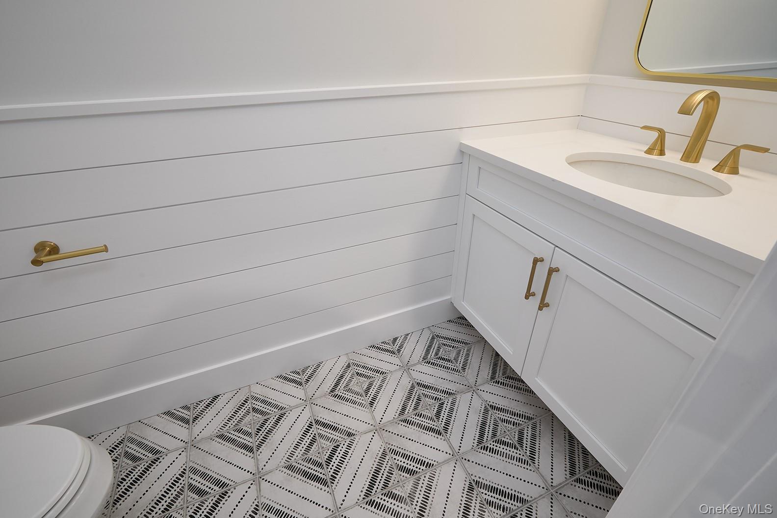 1480 Adam Place Wantagh, NY 11793 - Photo 12 of 22 Bathroom with vanity and tile patterned flooring