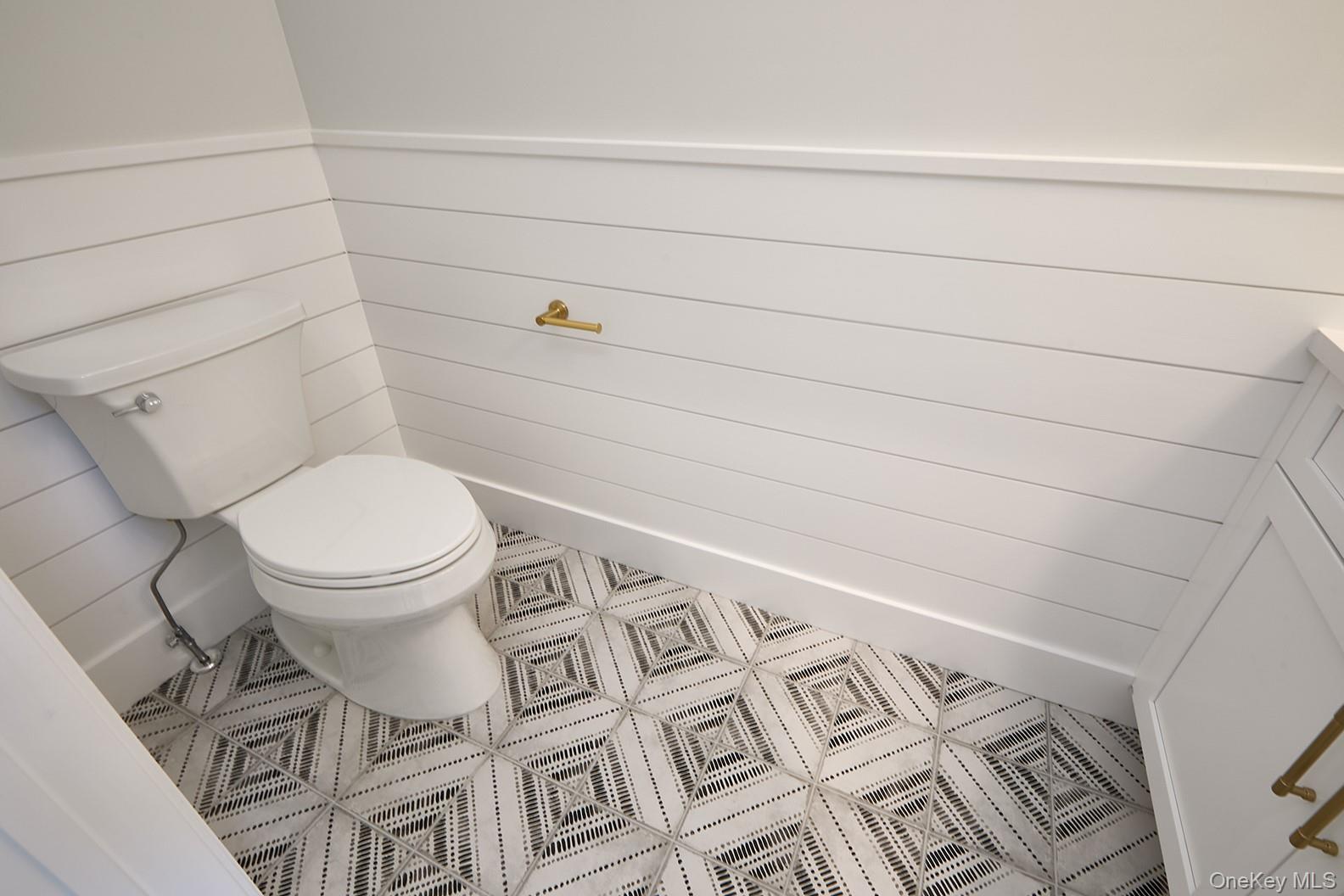 1480 Adam Place Wantagh, NY 11793 - Photo 13 of 22 Half bathroom featuring tile patterned flooring and vanity