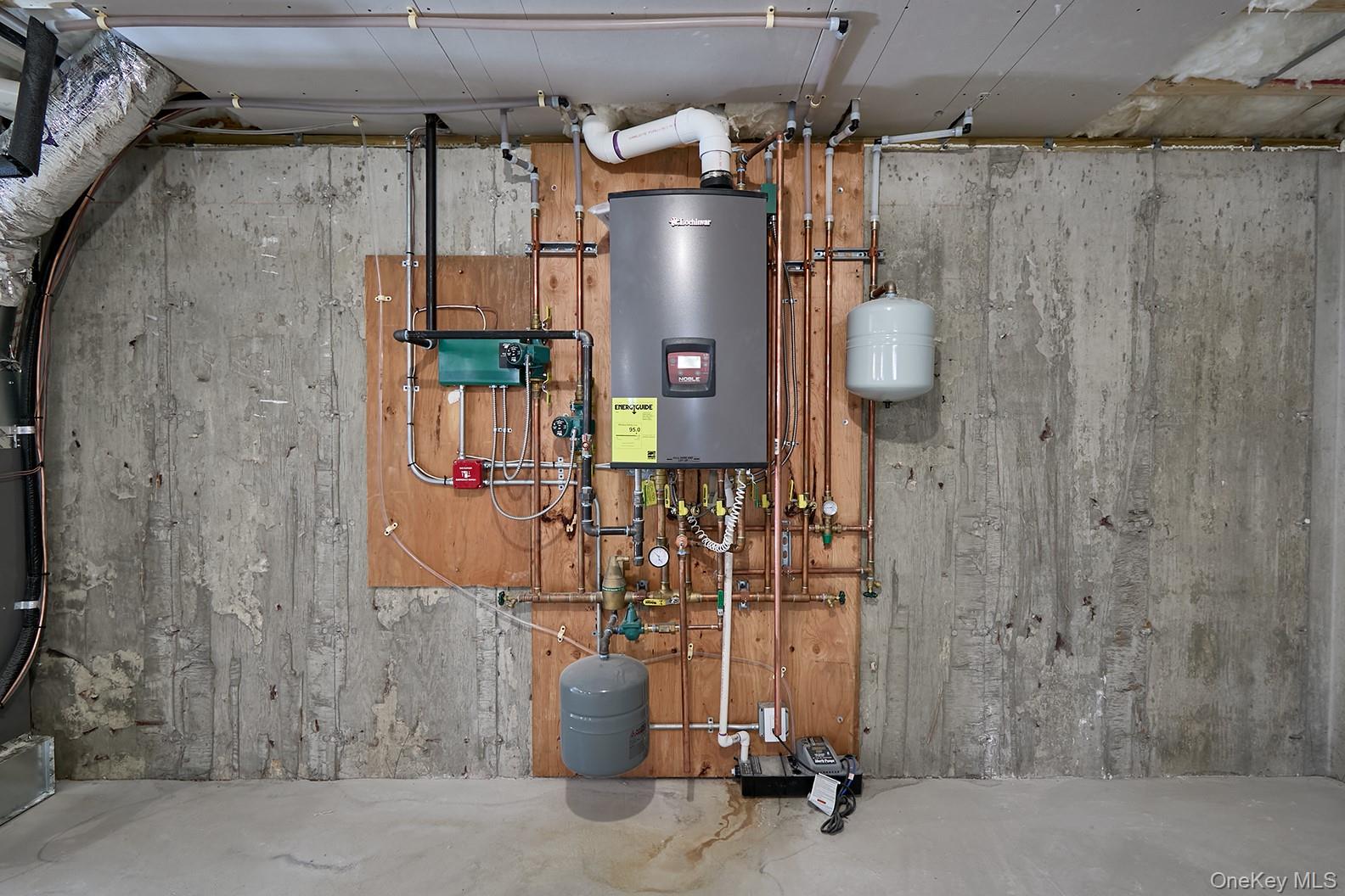 1480 Adam Place Wantagh, NY 11793 - Photo 21 of 22 Utilities with tankless water heater
