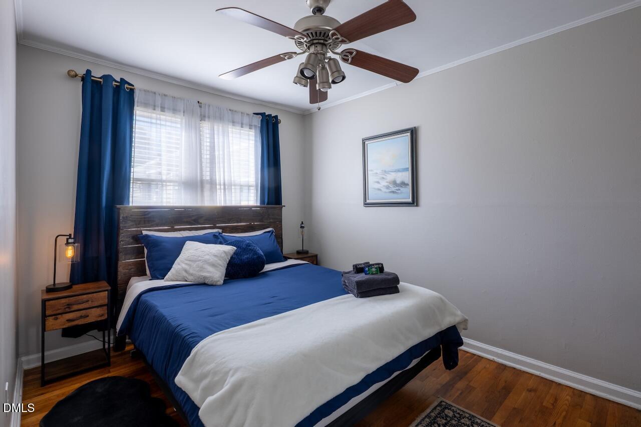 2333 Bernard Street Raleigh, NC 27608 - Photo 6 of 19 a bedroom with a bed and a window