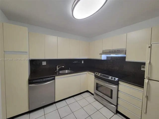 a bathroom with a shower and a glass door