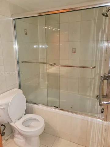 a view of a cars park in front of a building