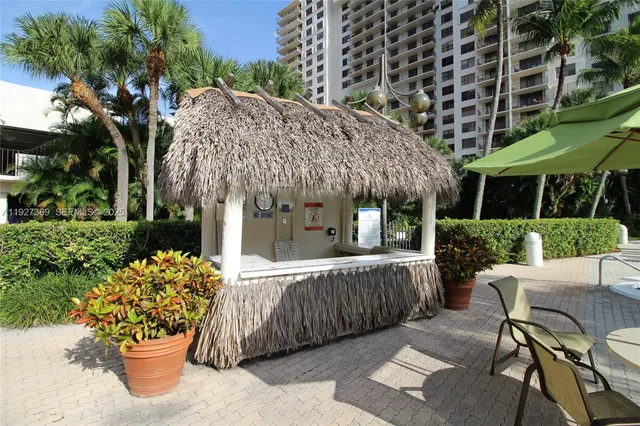 a room with gym equipment equipment and a large window