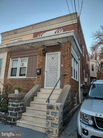 a view of a building with car parked