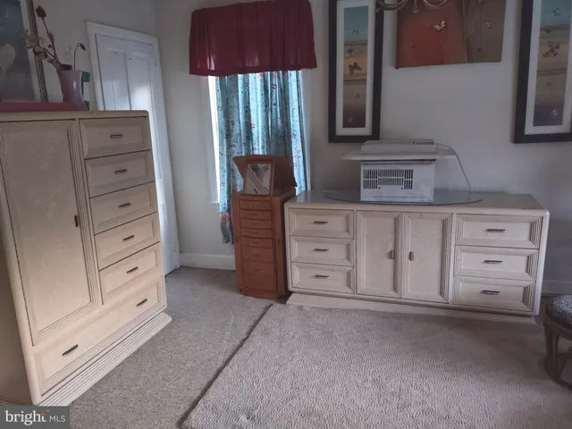 a room with a closet and wooden floor