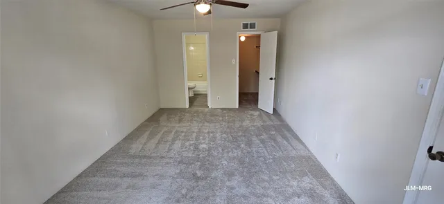 an empty room with closet area