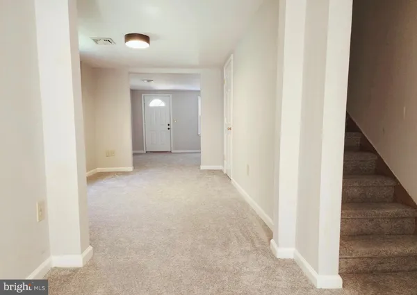 a view of a hallway with closet