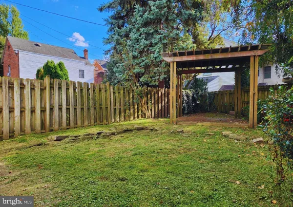 a view of a house with a small yard and plants
