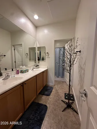 a bathroom with a sink a vanity and a mirror