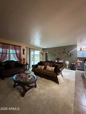a living room with furniture window and a table