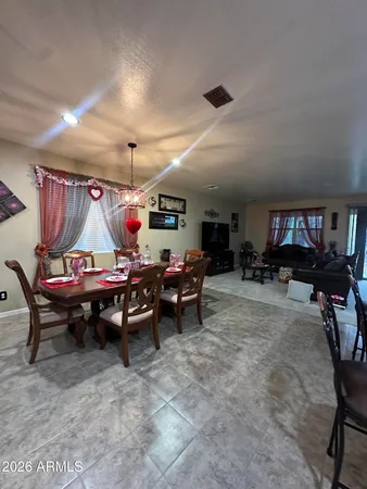 a garage with table tennis air hockey table and couches