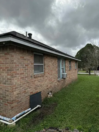 a backyard of a house with lots of green space