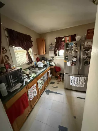 a kitchen with lots of counter top space and a window