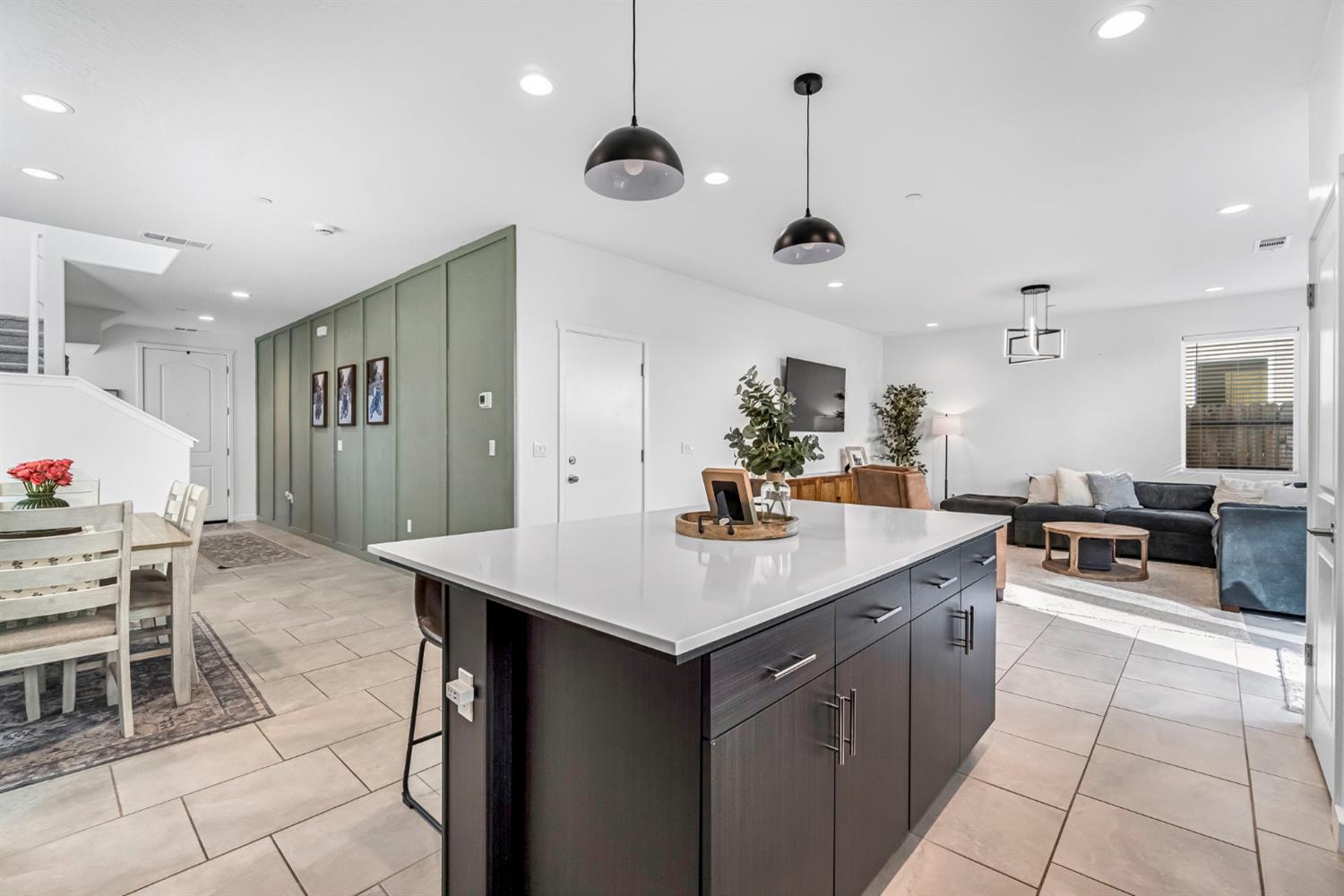 367 Talus Way South Madera, CA 93636 - Photo 12 of 40 a kitchen with stainless steel appliances kitchen island granite countertop a table chairs and a sink