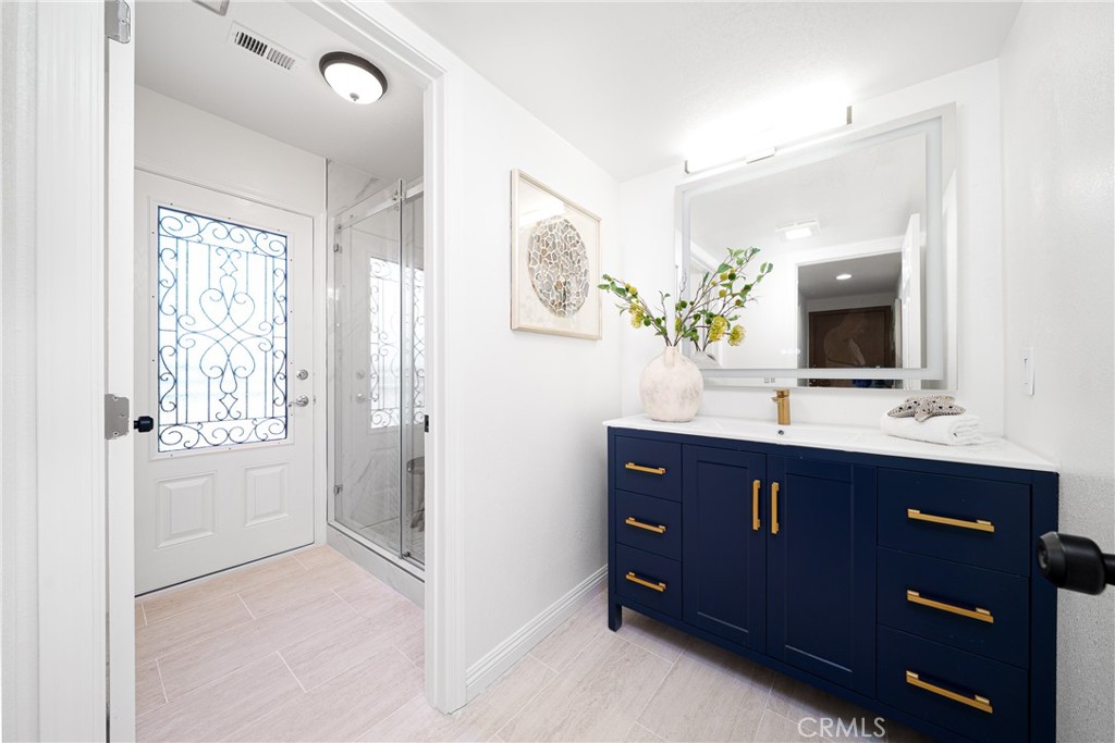 12982 Arapaho Road Rancho Cucamonga, CA 91739 - Photo 24 of 51 a bathroom with a sink and a mirror