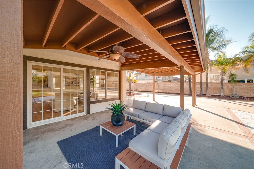 12982 Arapaho Road Rancho Cucamonga, CA 91739 - Photo 33 of 51 a living room with furniture and a floor to ceiling window
