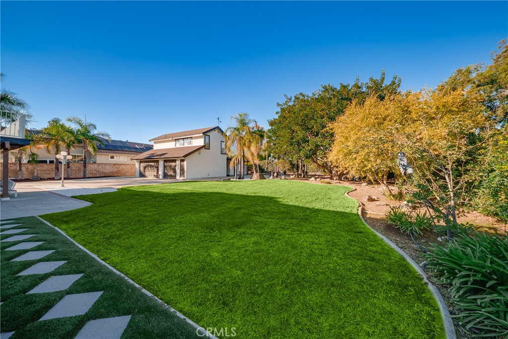 12982 Arapaho Road Rancho Cucamonga, CA 91739 - Photo 35 of 51 a view of a house with a big yard