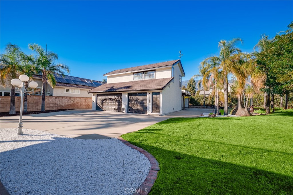 12982 Arapaho Road Rancho Cucamonga, CA 91739 - Photo 36 of 51 a view of house with outdoor space and pathway