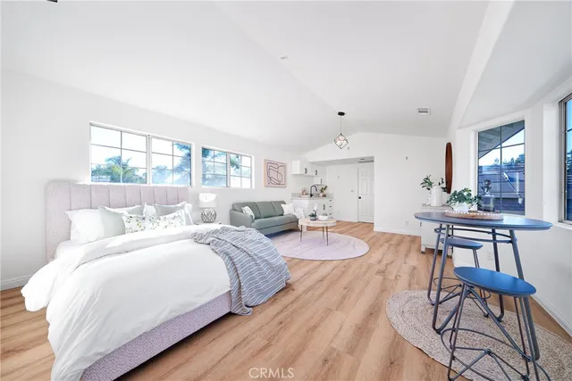 a bedroom with a bed and a table