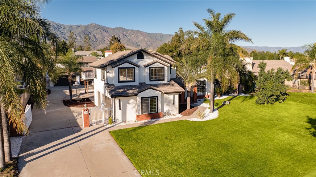 12982 Arapaho Road Rancho Cucamonga, CA 91739 - Photo 45 of 51 a front view of a house with a yard