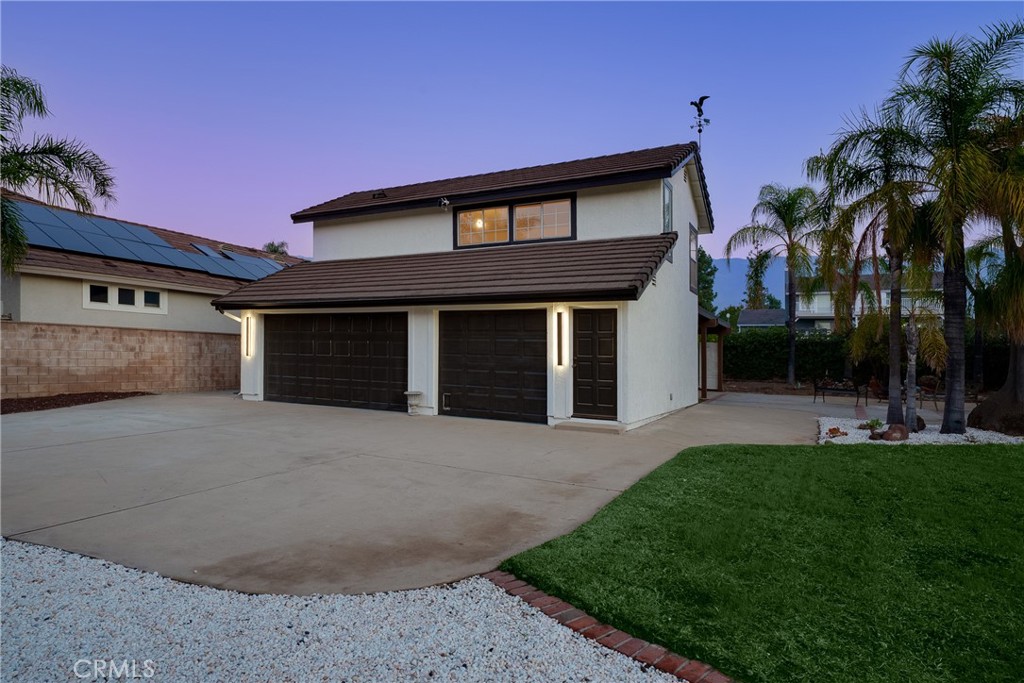12982 Arapaho Road Rancho Cucamonga, CA 91739 - Photo 8 of 51 a front view of a house with a yard and garage