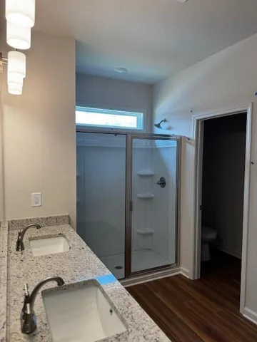 a bathroom with a sink and toilet