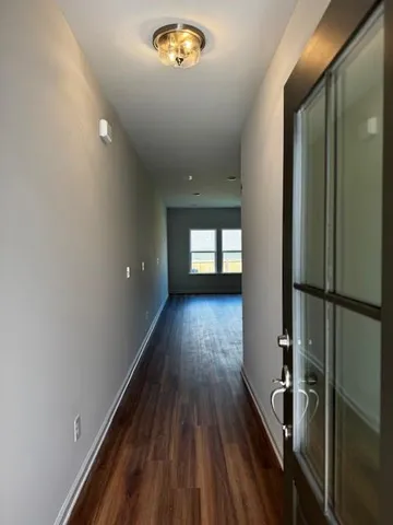 a view of gallery with wooden floor