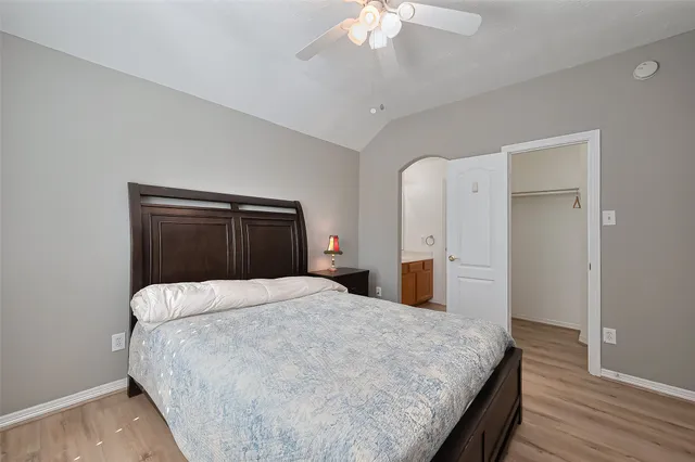 a bedroom with a bed and a dresser