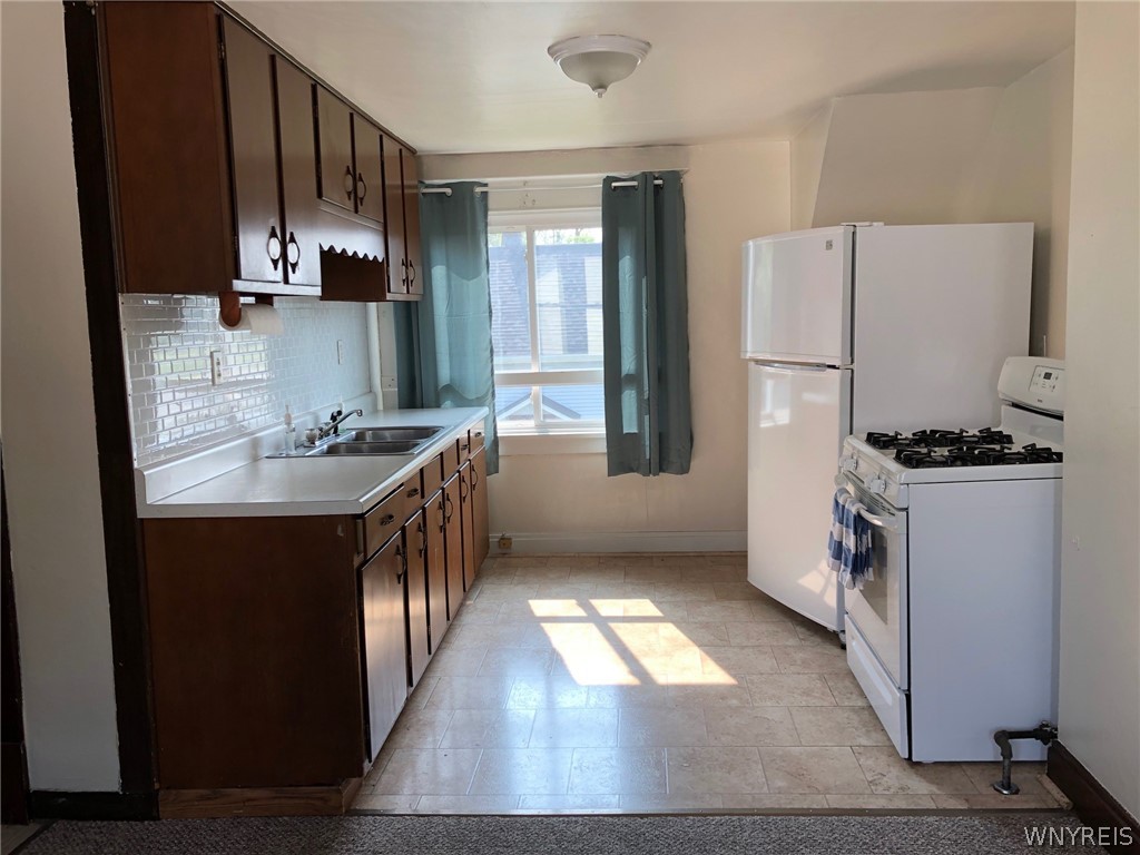 271 Bennett Road Cheektowaga, NY 14227 - Photo 14 of 27 UPPER KITCHEN WITH GAS STOVE & REFRIGERATOR