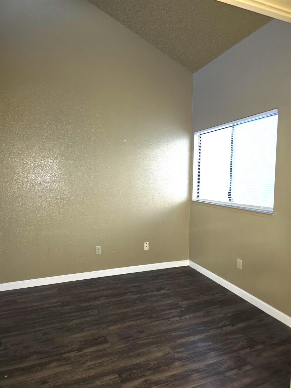 3939 Madison Avenue, Unit 220 North Highlands, CA 95660 - Photo 3 of 12 a view of a room with wooden floor and windows