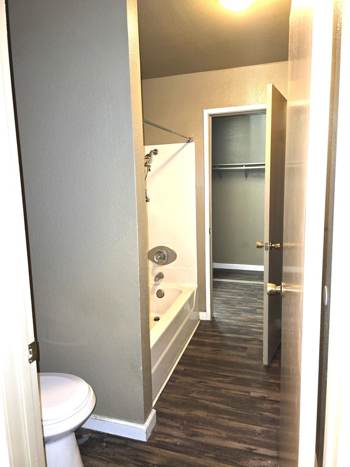 3939 Madison Avenue, Unit 220 North Highlands, CA 95660 - Photo 8 of 12 a bathroom with a toilet and a shower