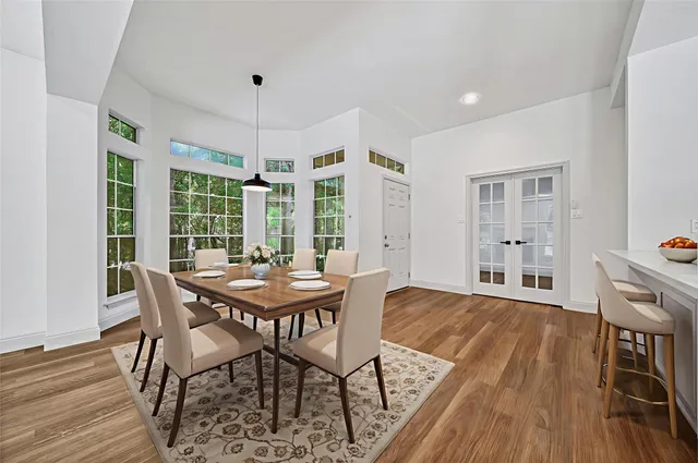 a dining room with furniture window wooden floor
