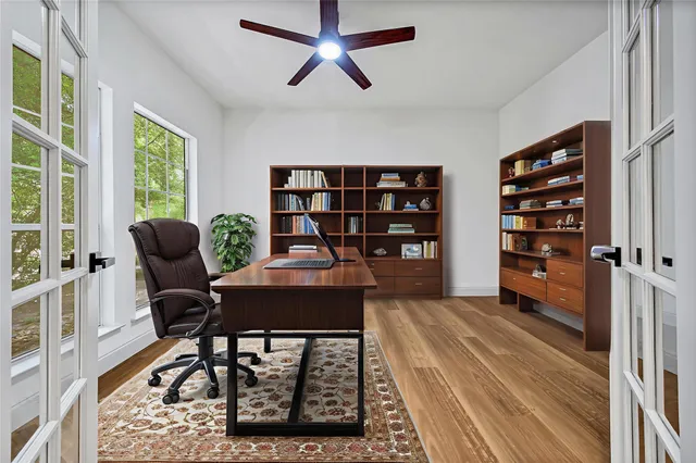a workspace with furniture and a book shelf