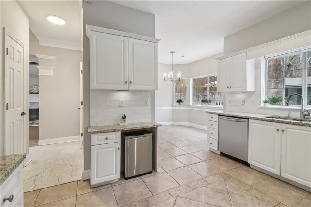 175 Meredith Way Stockbridge, GA 30281 - Photo 26 of 75 a kitchen with stainless steel appliances granite countertop a sink and cabinets