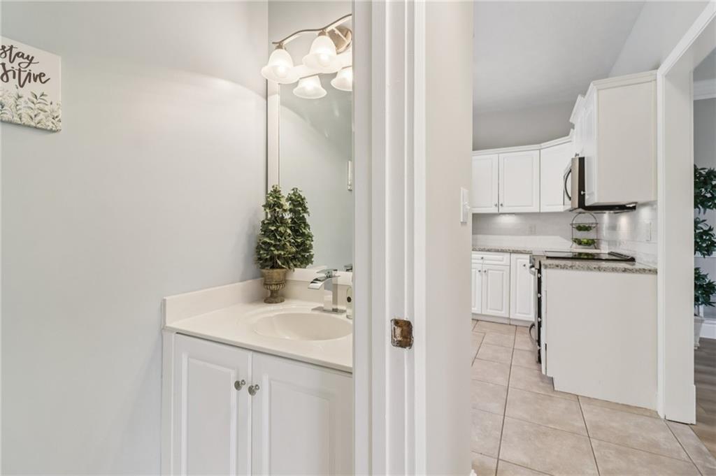 175 Meredith Way Stockbridge, GA 30281 - Photo 27 of 75 a bathroom with a sink and a mirror