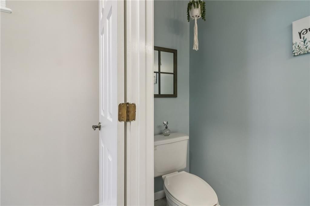 175 Meredith Way Stockbridge, GA 30281 - Photo 28 of 75 a white toilet sitting next to a bathroom sink