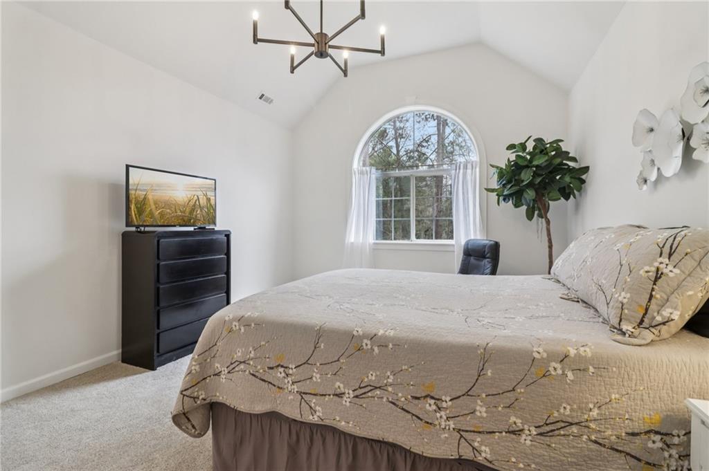 175 Meredith Way Stockbridge, GA 30281 - Photo 31 of 75 a bedroom with a bed and a television