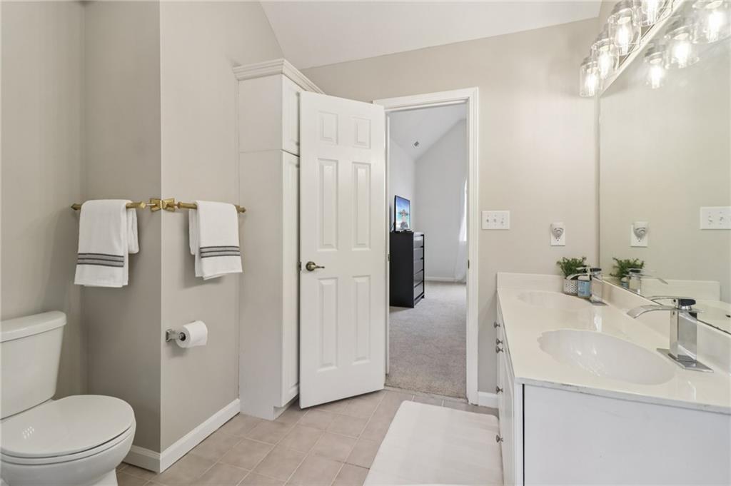 175 Meredith Way Stockbridge, GA 30281 - Photo 37 of 75 a bathroom with a sink a toilet and shower
