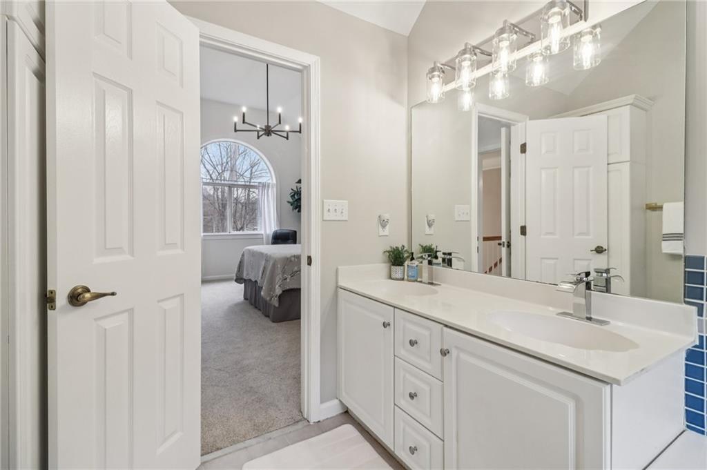 175 Meredith Way Stockbridge, GA 30281 - Photo 38 of 75 a en suite bathroom with a double vanity sink and mirror