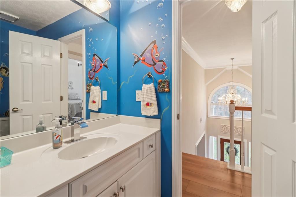 175 Meredith Way Stockbridge, GA 30281 - Photo 40 of 75 a bathroom with a sink vanity and a mirror