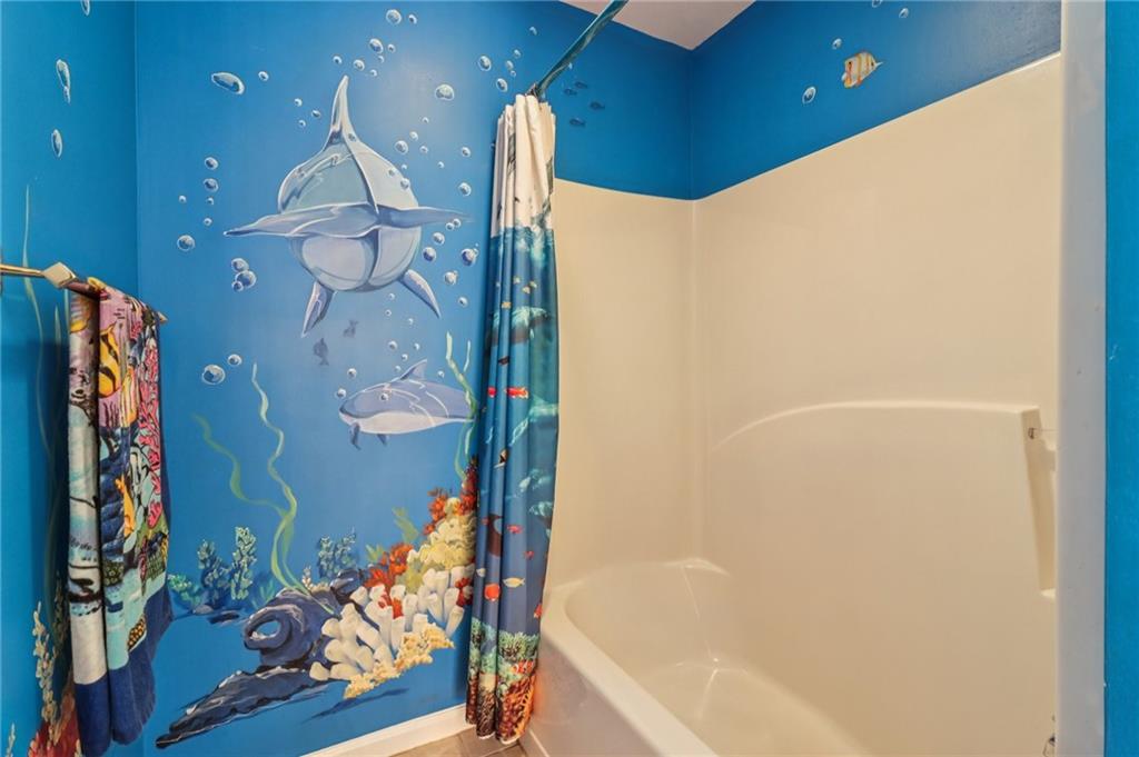 175 Meredith Way Stockbridge, GA 30281 - Photo 41 of 75 a bathroom with a bathtub and a shower