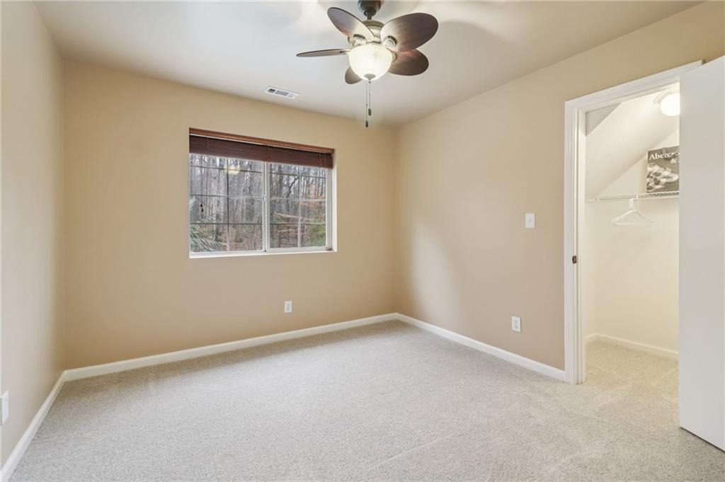 175 Meredith Way Stockbridge, GA 30281 - Photo 47 of 75 an empty room with a window and a fan