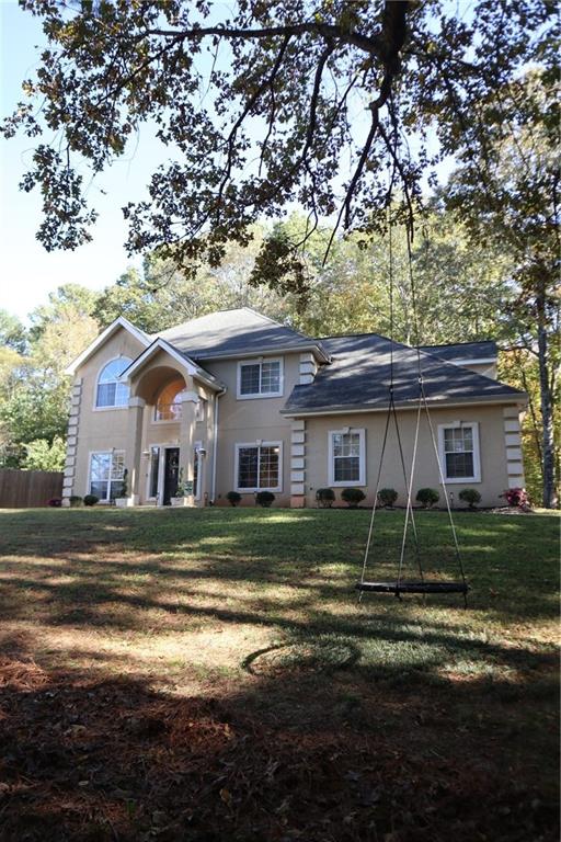 175 Meredith Way Stockbridge, GA 30281 - Photo 9 of 75 a front view of a house with a yard