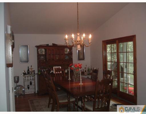 14 Peake Road Edison, NJ 08837 - Photo 4 of 8 a view of a dining room with furniture and chandelier or chandelier
