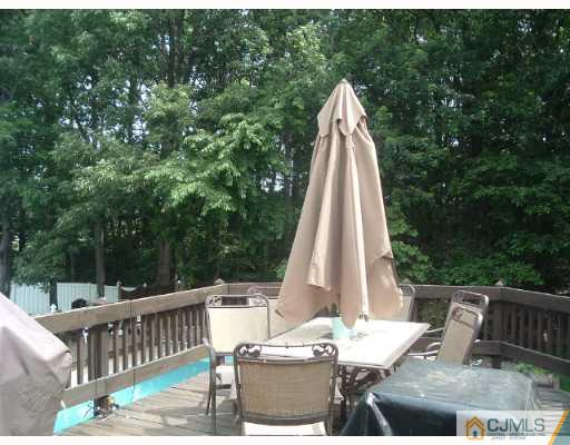 14 Peake Road Edison, NJ 08837 - Photo 5 of 8 a view of a patio with a table and chairs