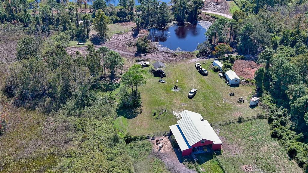 806 West Ariel Road Edgewater, FL 32141 - Photo 1 of 12 an aerial view of a house with a yard and trees