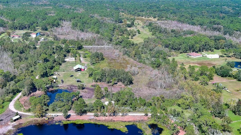 806 West Ariel Road Edgewater, FL 32141 - Photo 8 of 12 an aerial view of house with yard swimming pool and outdoor seating