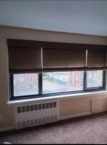 a view of a car park in front of a house